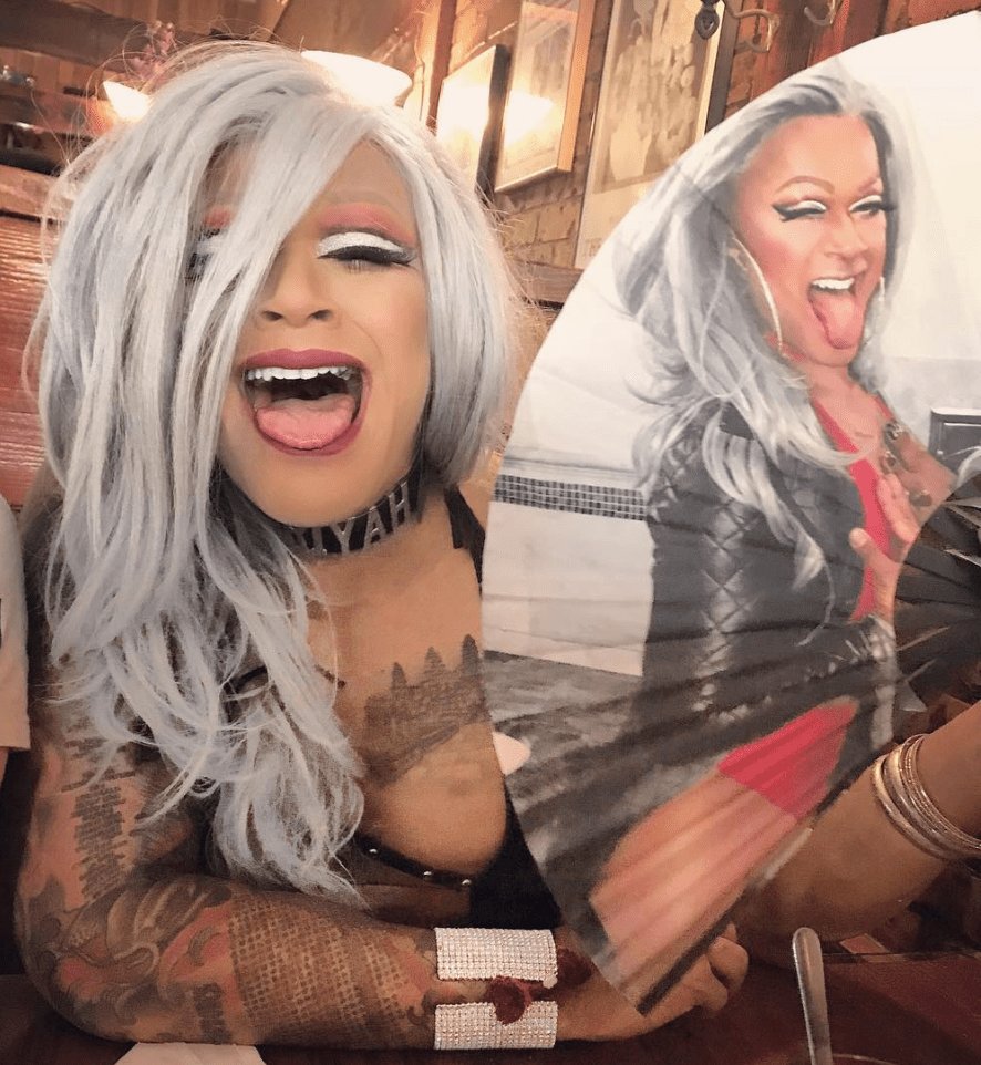 A drag queen with a custom Daftboy fan
