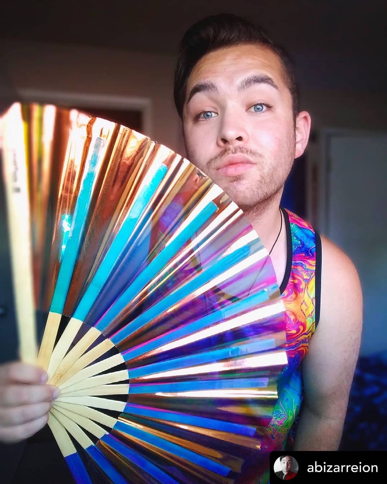 Creator @abizarreion taking a selfie with a holographic Daftboy fan