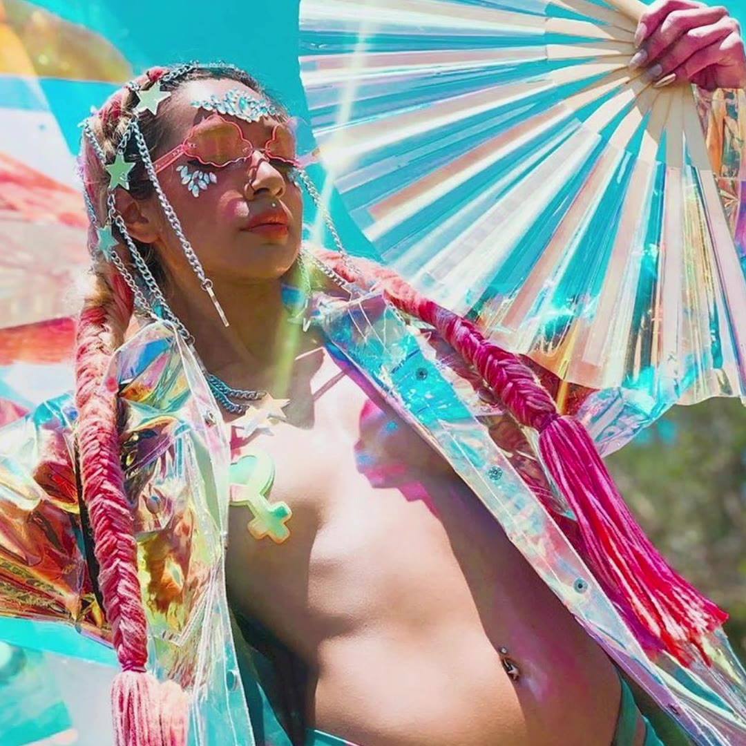 Festival creator with a holographic Daftboy rave fan