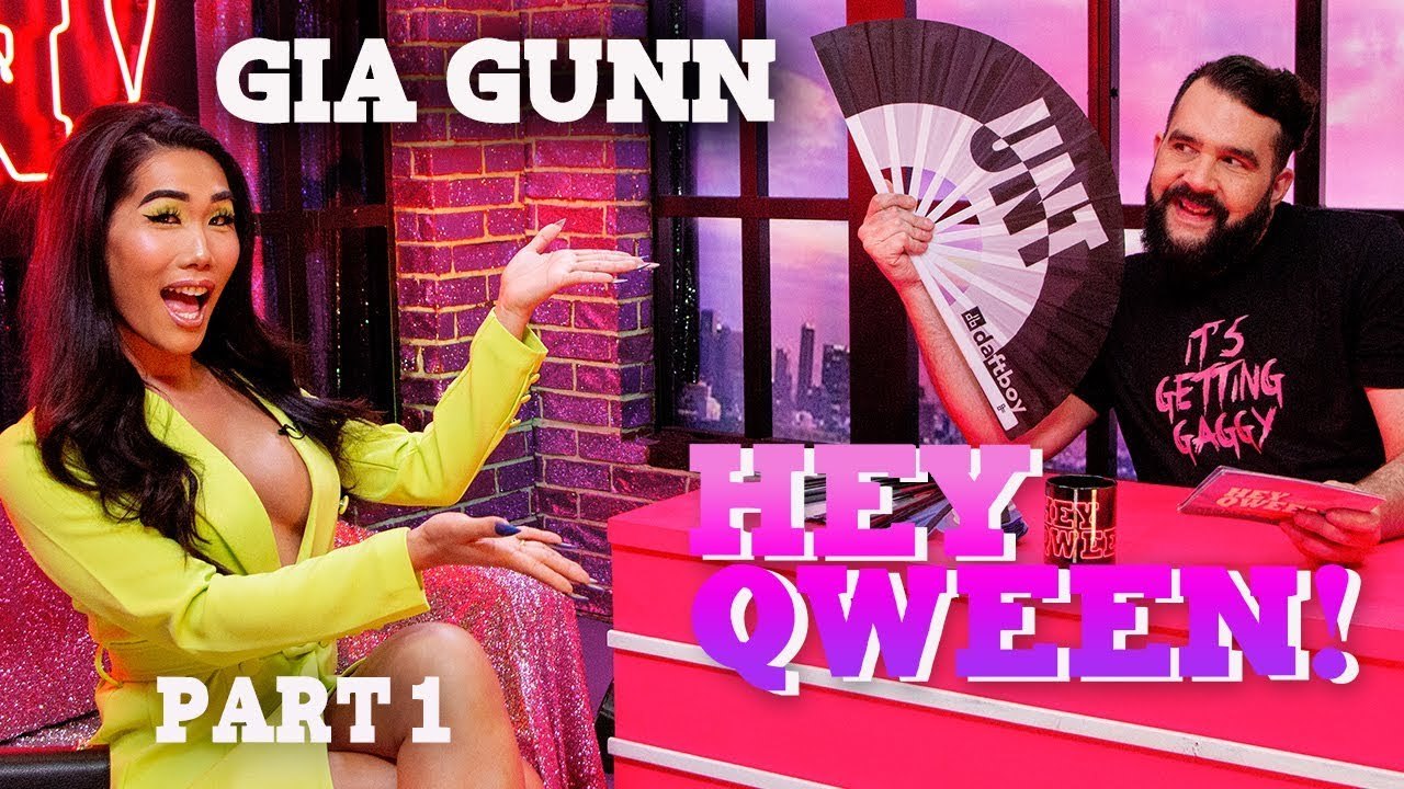 Jonny McGovern holding a Daftboy UNT fan on the Hey Qween! set with guest Gia Gunn