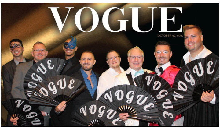 Guests at a nonprofit fundraiser holding custom Daftboy VOGUE fans