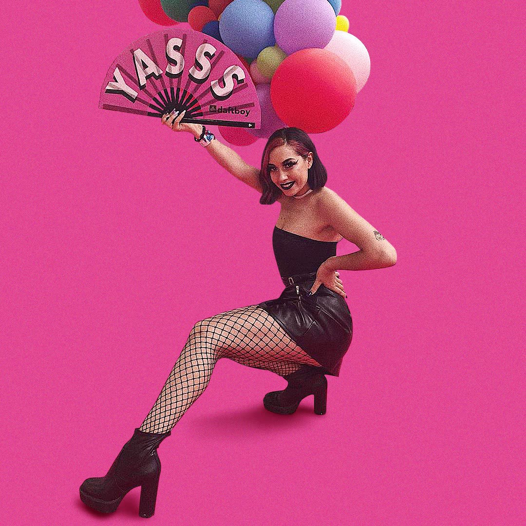 Model posing with a Daftboy YASSS clack fan and balloons