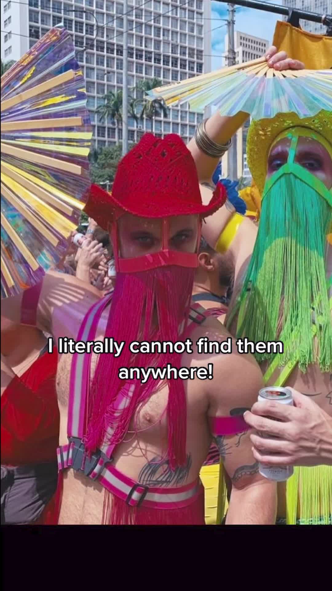 Pride crowd in harnesses with holographic Daftboy fans, filmed for TikTok